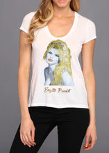 Model wearing white T-shirt with hand-painted Brigitte Bardot portrait, stylish and elegant art to wear.