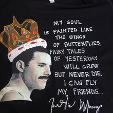 hand-painted Freddie Mercury profile with crown and butterfly on black tshirt, featuring poetic phrase.