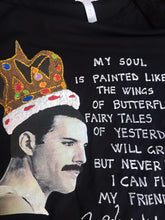 Close-up of hand  painted  personalized T-shirt of Freddie Mercury with crown