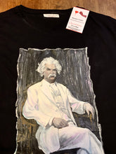 Close-up of Mark Twain's portrait  painted on black T-shirt in permanent textured colors