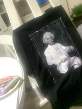 Full view of hand-painted Mark Twain T-shirt on the artist's easel