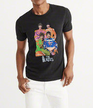 Model wearing a hand-painted Beatles t-shirt with full-body Sgt. Pepper portraits, painted in vivid color and unique artistic style.