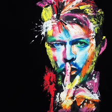 Zoomed-in view of hand-painted Bowie portrait on black T-shirt – bold strokes and striking color contrast