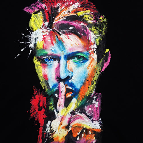 Close-up of David Bowie’s colorful painted face on black T-shirt – vivid 3D texture and expressive brushwork