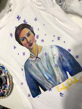 Hand of Artist  painting Emily Dickinson portrait on T-shirt using permanent colors in relief