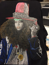 Freshly hand-painted Erykah Badu T-shirt drying – artistic wearable piece with vibrant 3D relief colors
