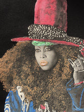 Close-up of hand-painted Erykah Badu portrait on T-shirt – colorful 3D relief detail and expressive afro-soul style