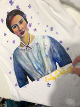 Hand of Artist  painting Emily Dickinson on T-shirt using permanent colors in relief
