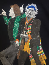 Detailed close-up of the hand-painted portrait of Mick Jagger and Keith Richards on a t-shirt, showcasing artistic texture and vivid colors.