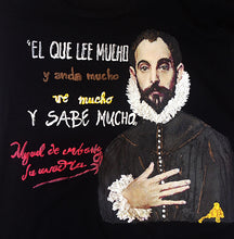 Close-up of Cervantes face with hand on chest and quote "El que lee mucho..." painted on relief on tee