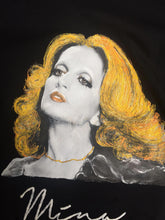 Close-up Original artistic t-shirt showcasing Mina’s hand-painted design  