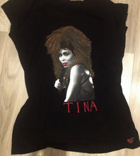 Black t-shirt featuring a hand-painted, artistic portrait of Tina Turner with voluminous hair holding a microphone
